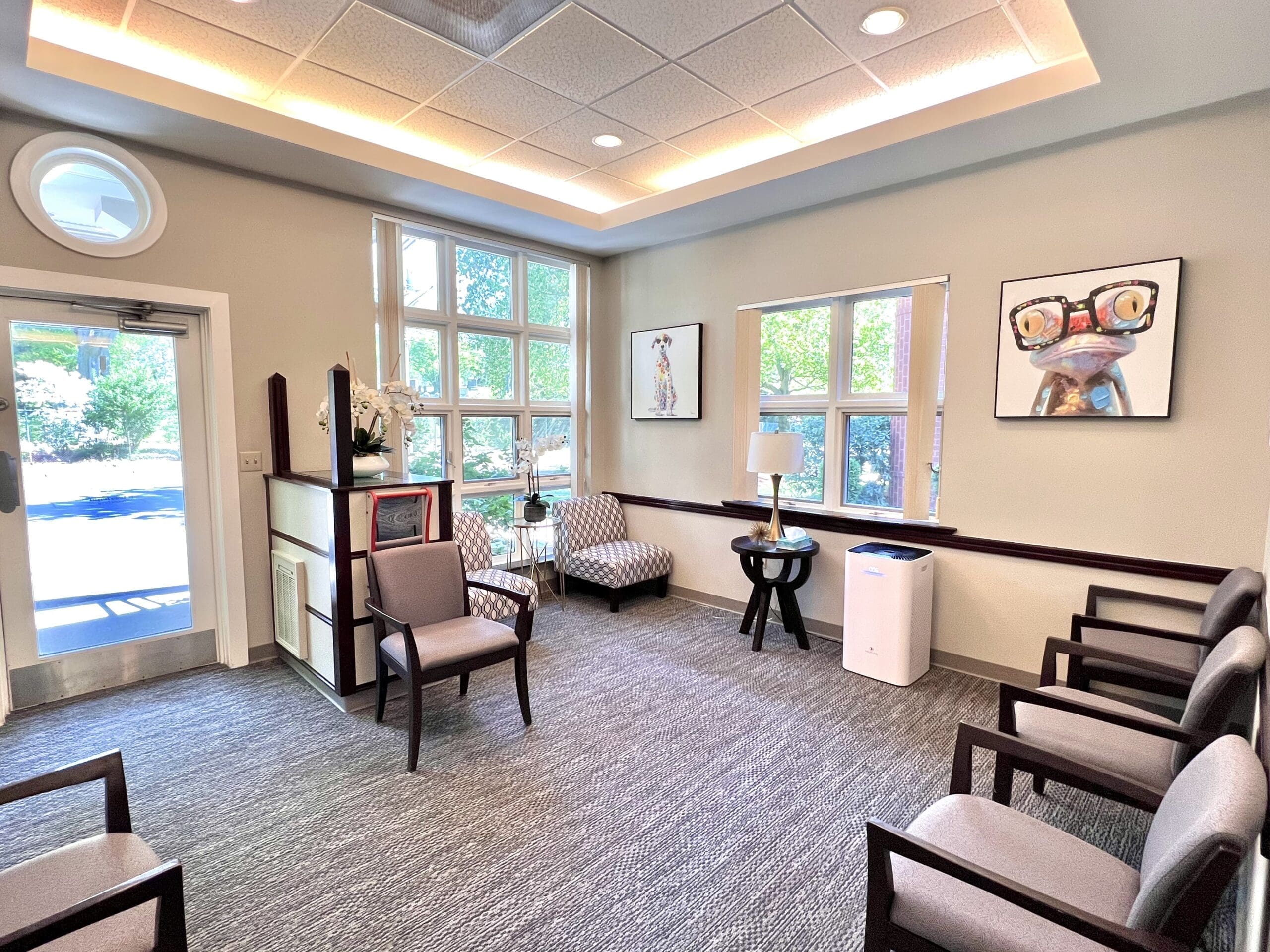 Comfortable waiting room at Waban Dental Group, serving Boston, Newton, and surrounding areas, designed for patient ease and relaxation.