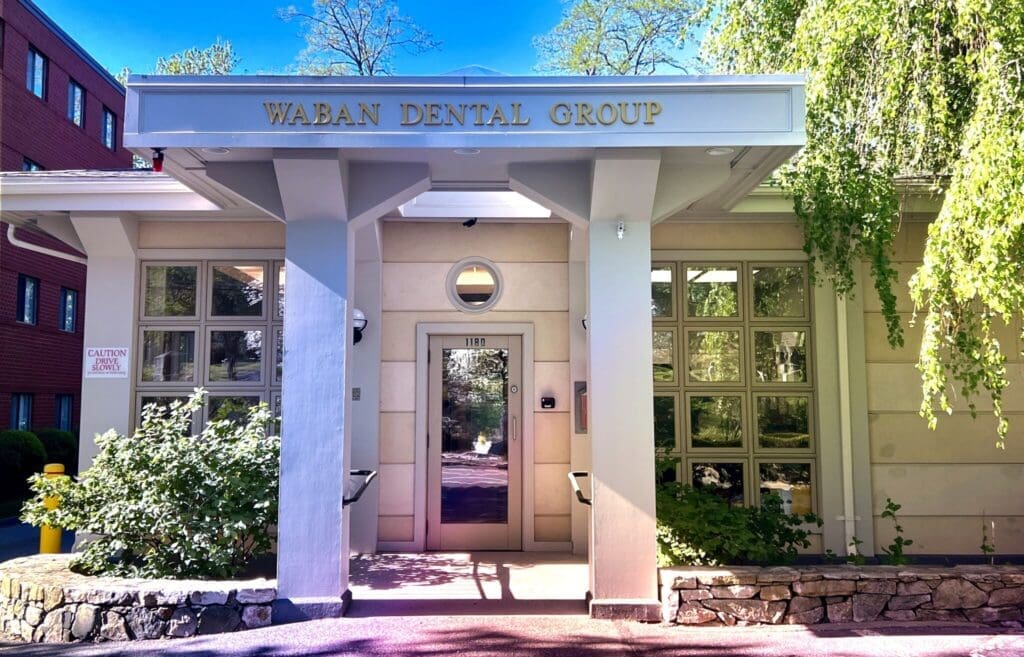 Close-up view of the entrance to Waban Dental Group in Newton, MA, showcasing the clinic's inviting and professional facade.