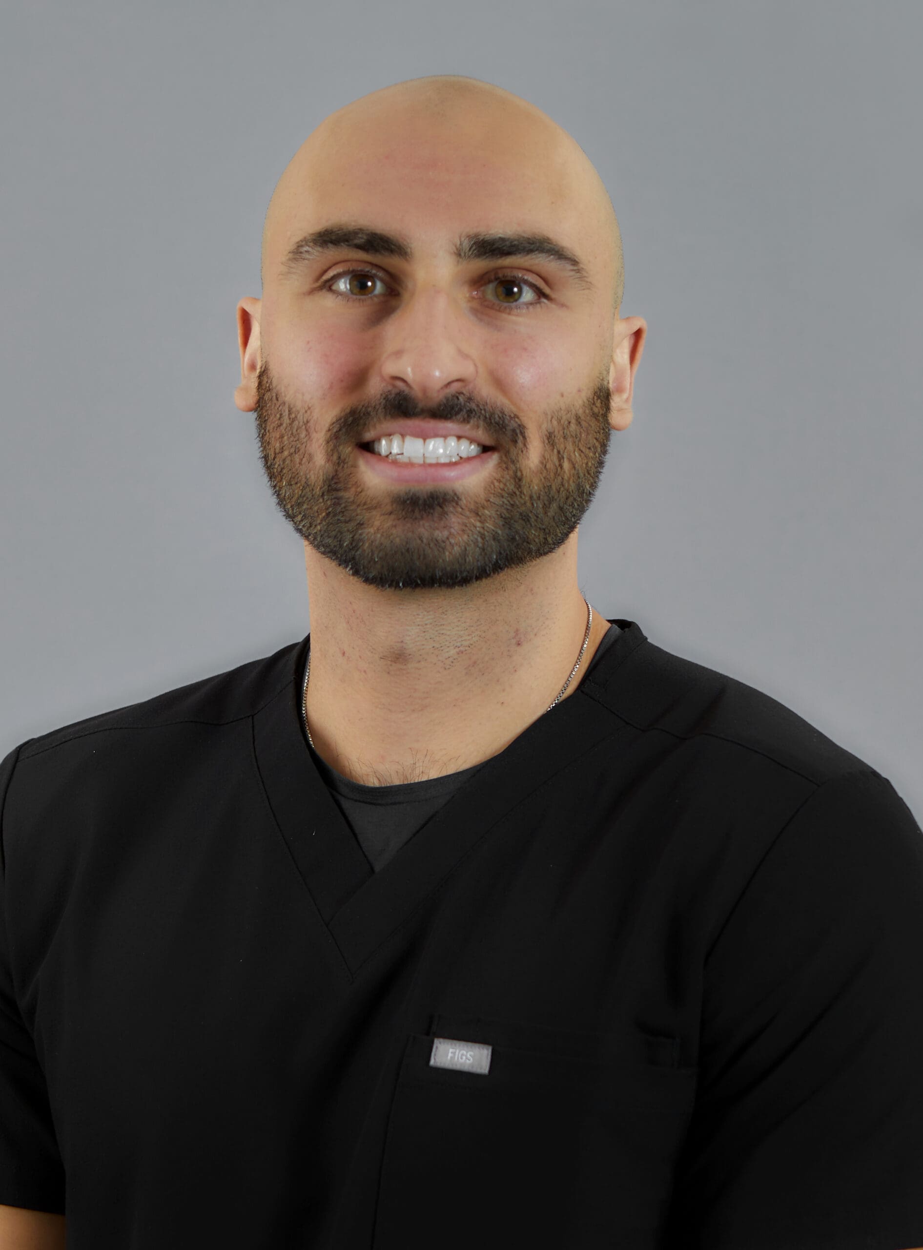A photo of Dr. Ohan Manoukian, a general dentist, smiling warmly.