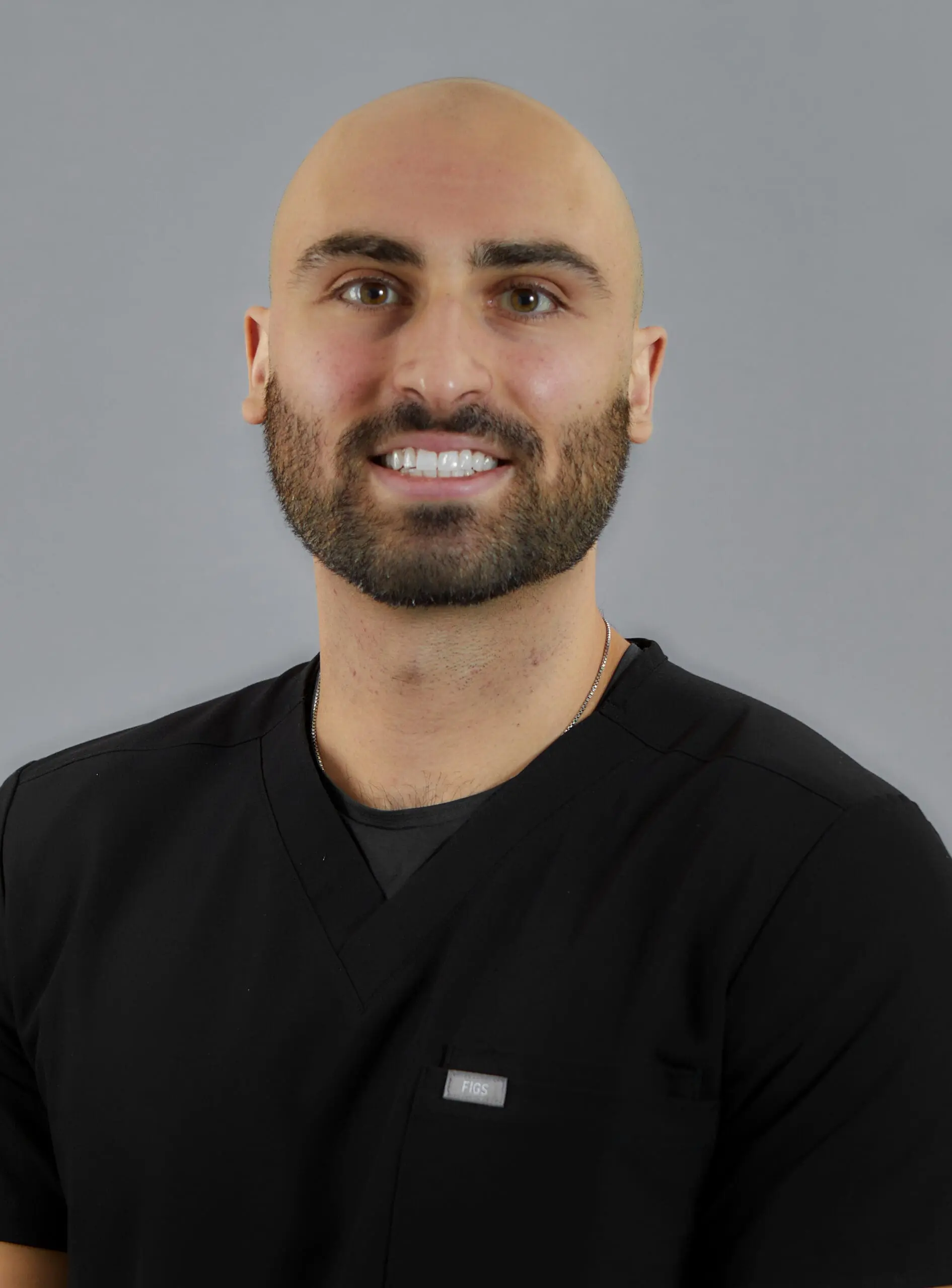 A photo of Dr. Ohan Manoukian, a general dentist, smiling warmly.