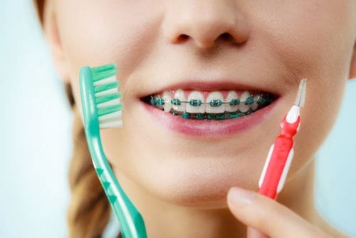 A child receiving ICON resin infiltration treatment at a dental clinic in Newton, MA."