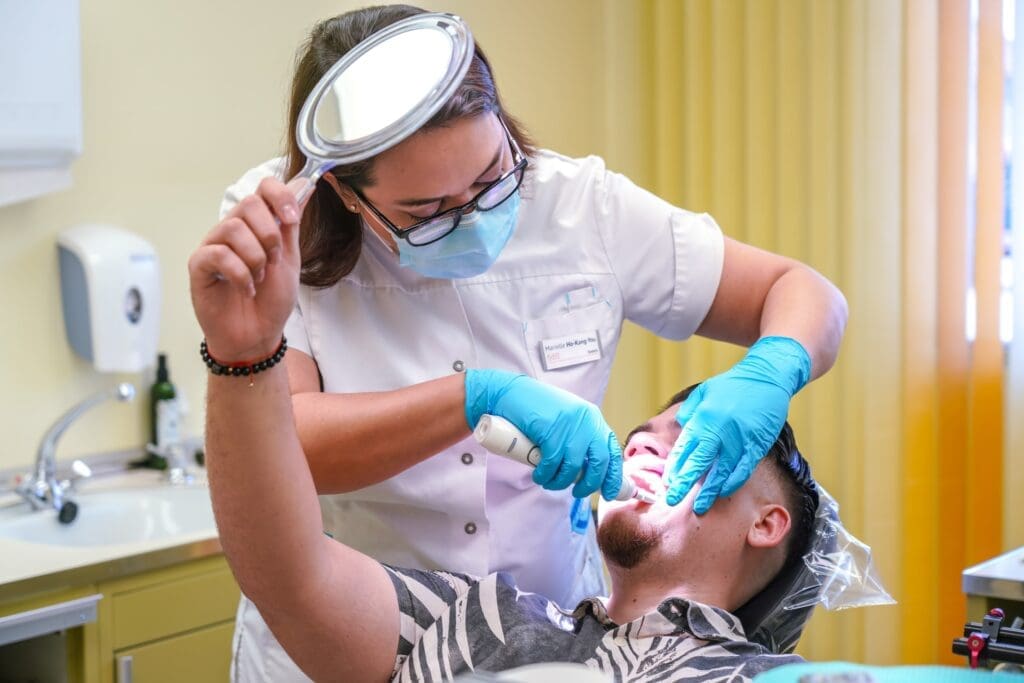 A person experiencing dental pain, indicating the need for urgent dental care.