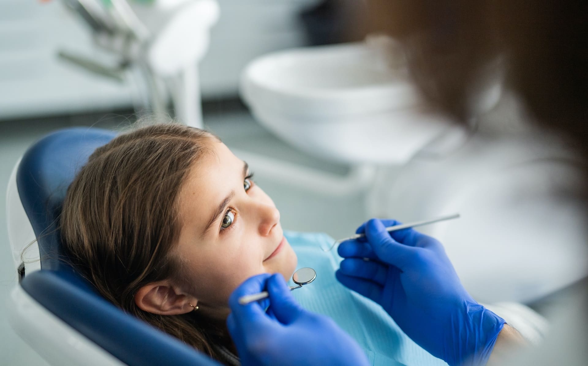 A child with special needs receiving dental care from a compassionate dentist at Waban Dental Group in Newton, MA.