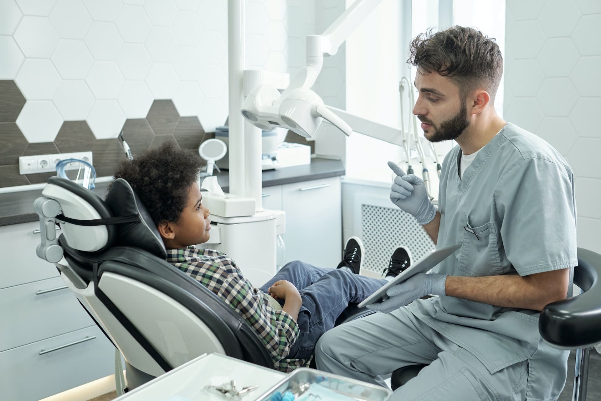 A child wearing a space maintainer at Waban Dental Group in Newton, MA.