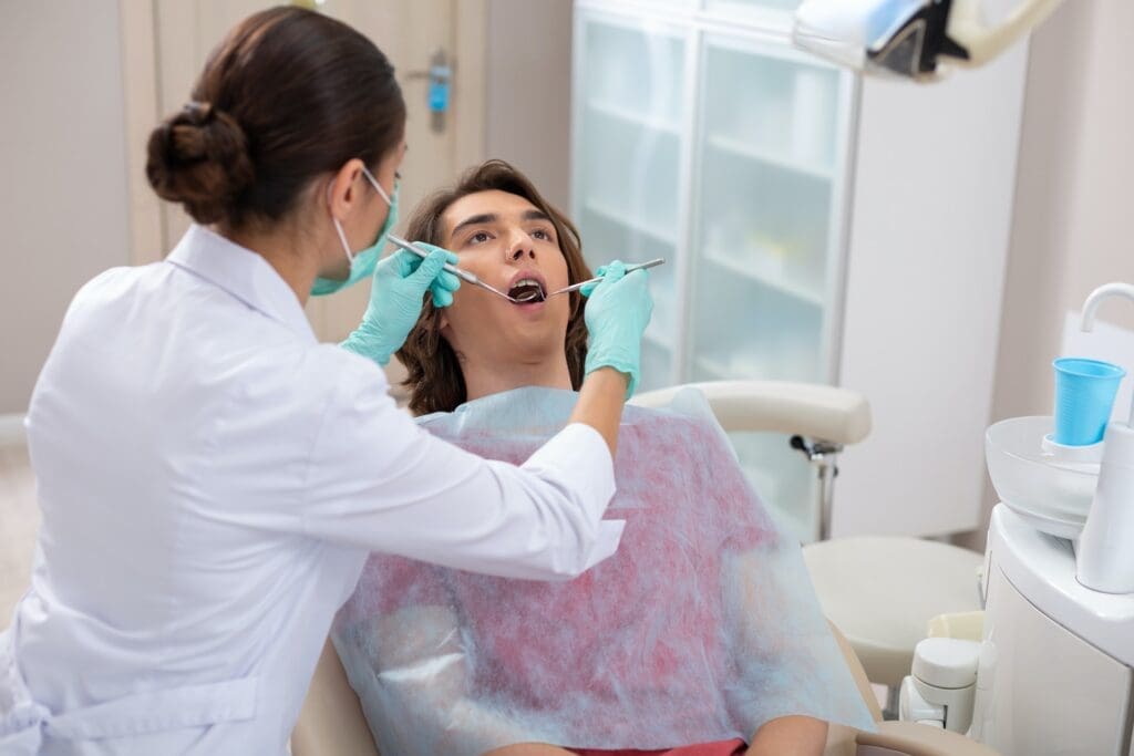 A patient undergoing dental implant treatment at Waban Dental Group in Newton, MA.