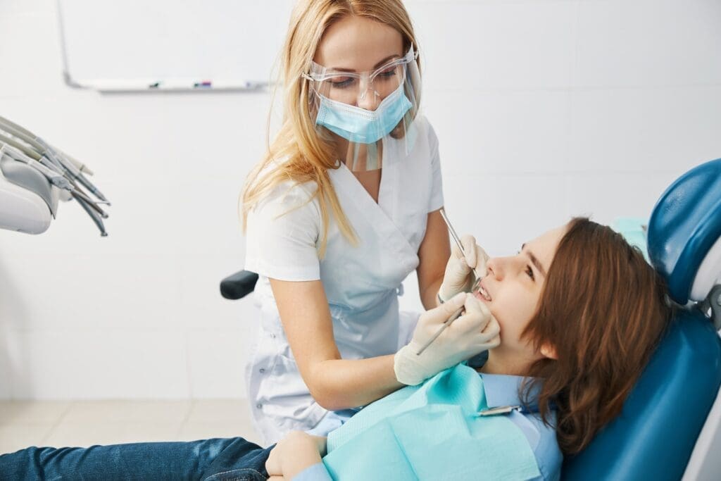 A child beginning their journey to a perfect smile with orthodontic treatment at Waban Dental Group in Newton, MA.