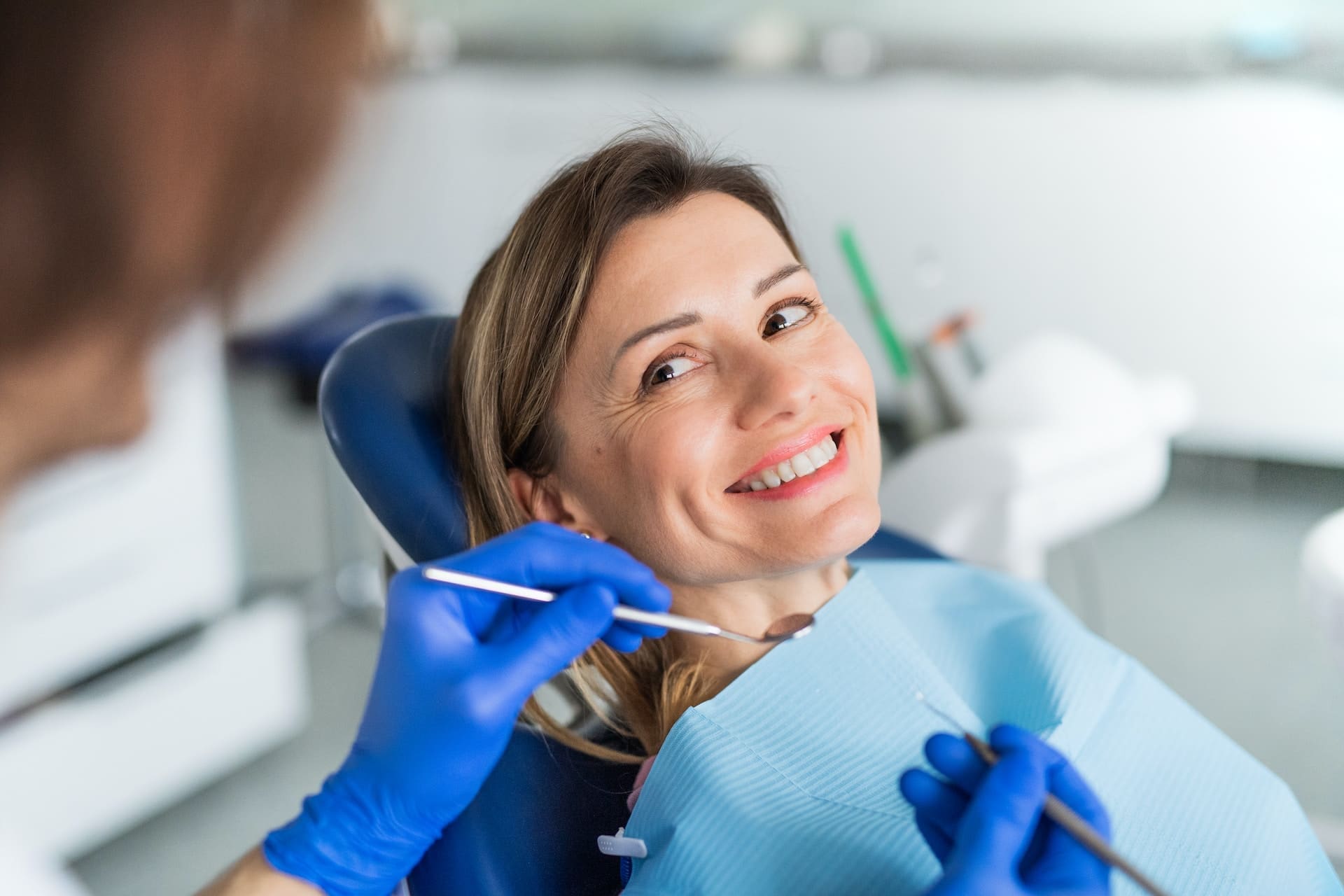 A person managing stress-related dental issues at Waban Dental Group in Newton, MA.