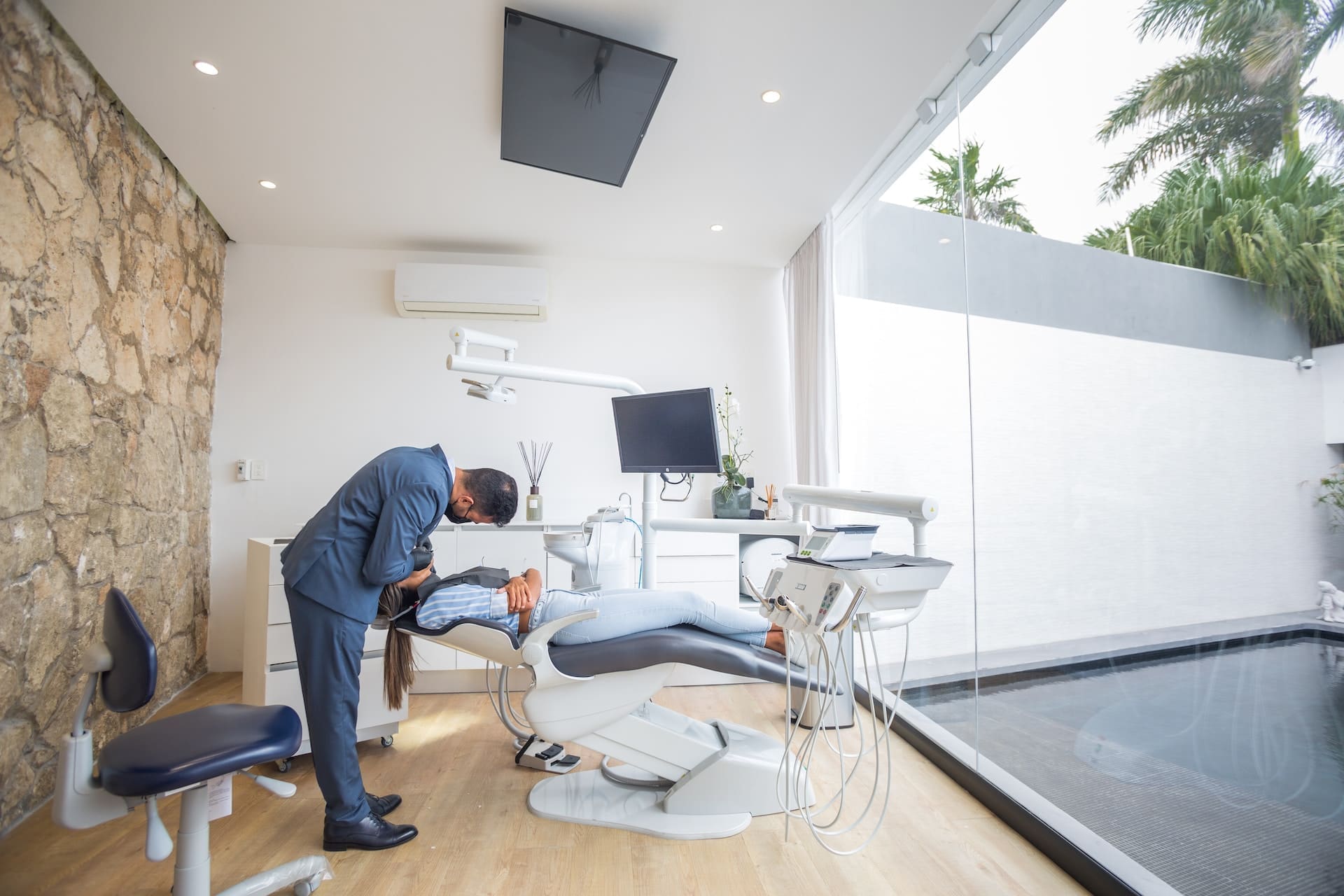 A person discussing important questions with their dentist at Waban Dental Group in Newton, MA.