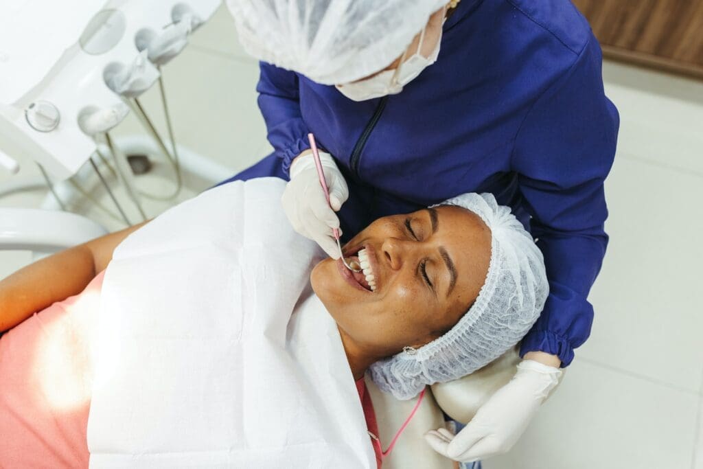 A person demonstrating essential habits for maintaining strong, beautiful teeth.