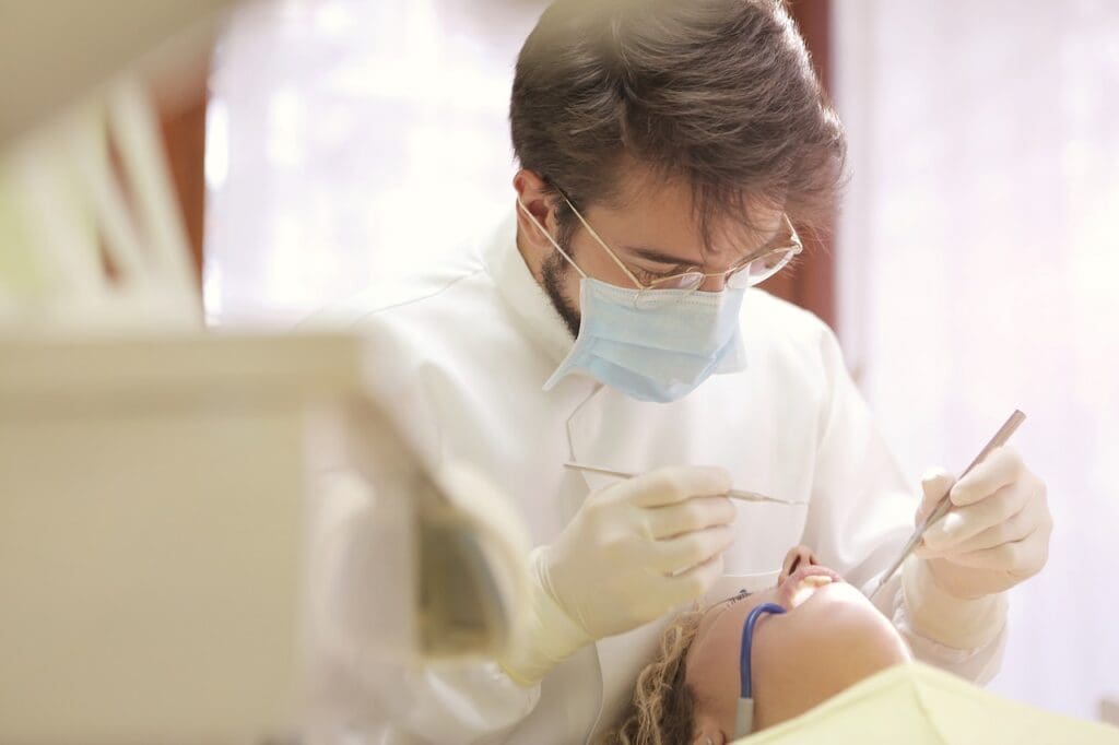 A patient receiving prompt emergency dental treatment at Waban Dental Group, ensured by the expertise of Newton's top dentists.