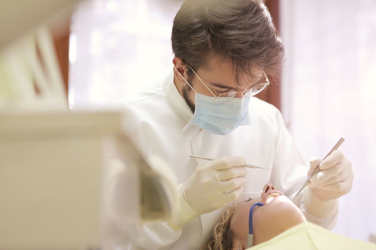 A patient receiving prompt emergency dental treatment at Waban Dental Group, ensured by the expertise of Newton's top dentists.