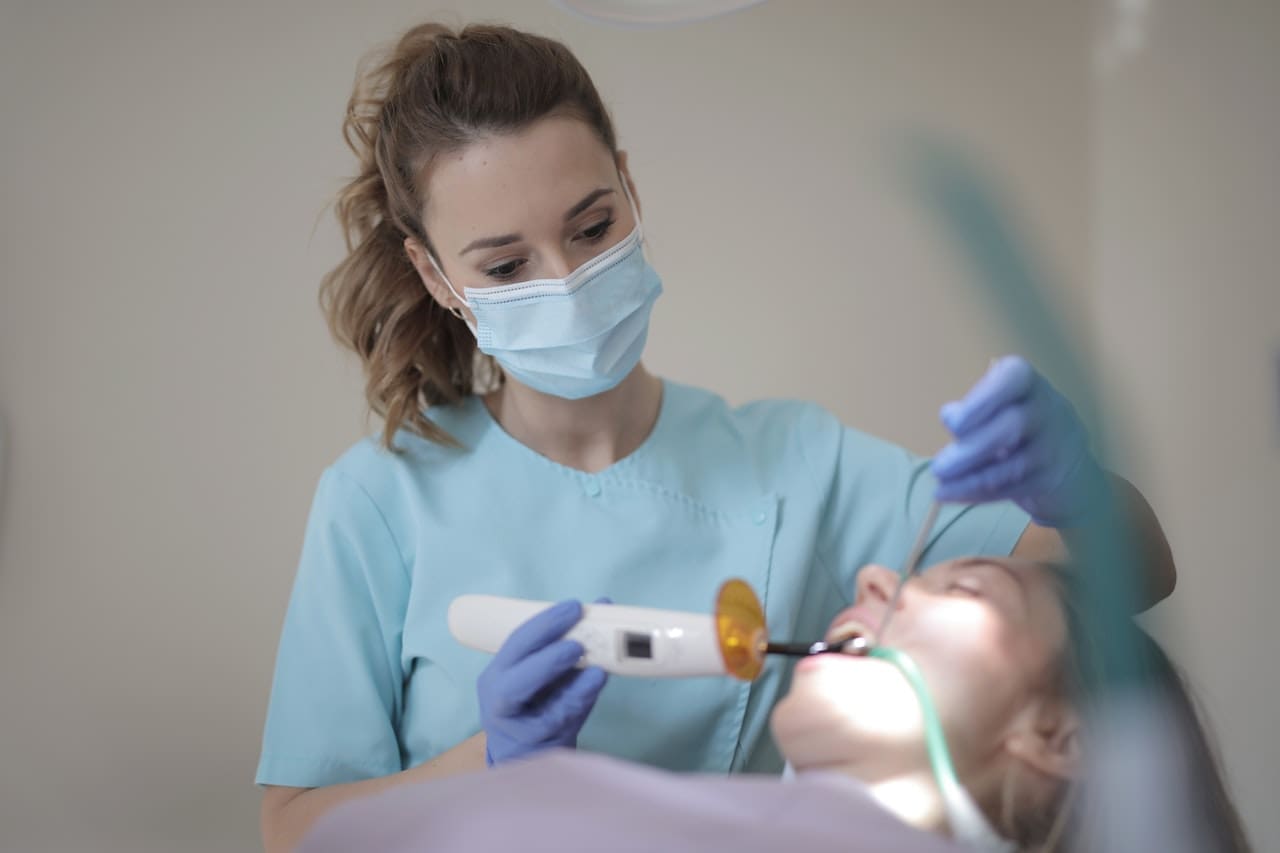 A child happily undergoing a pediatric dental exam at Waban Dental Group, ensuring a lifetime of oral health.