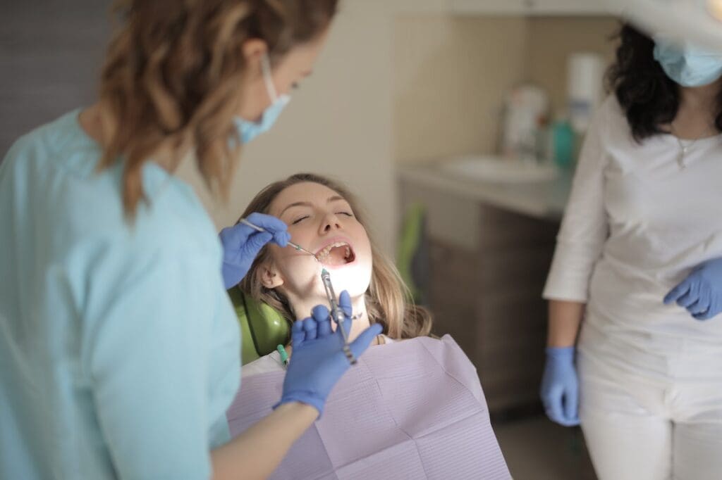 An adult consulting about orthodontic treatment options at Waban Dental Group, exploring the benefits for their smile.