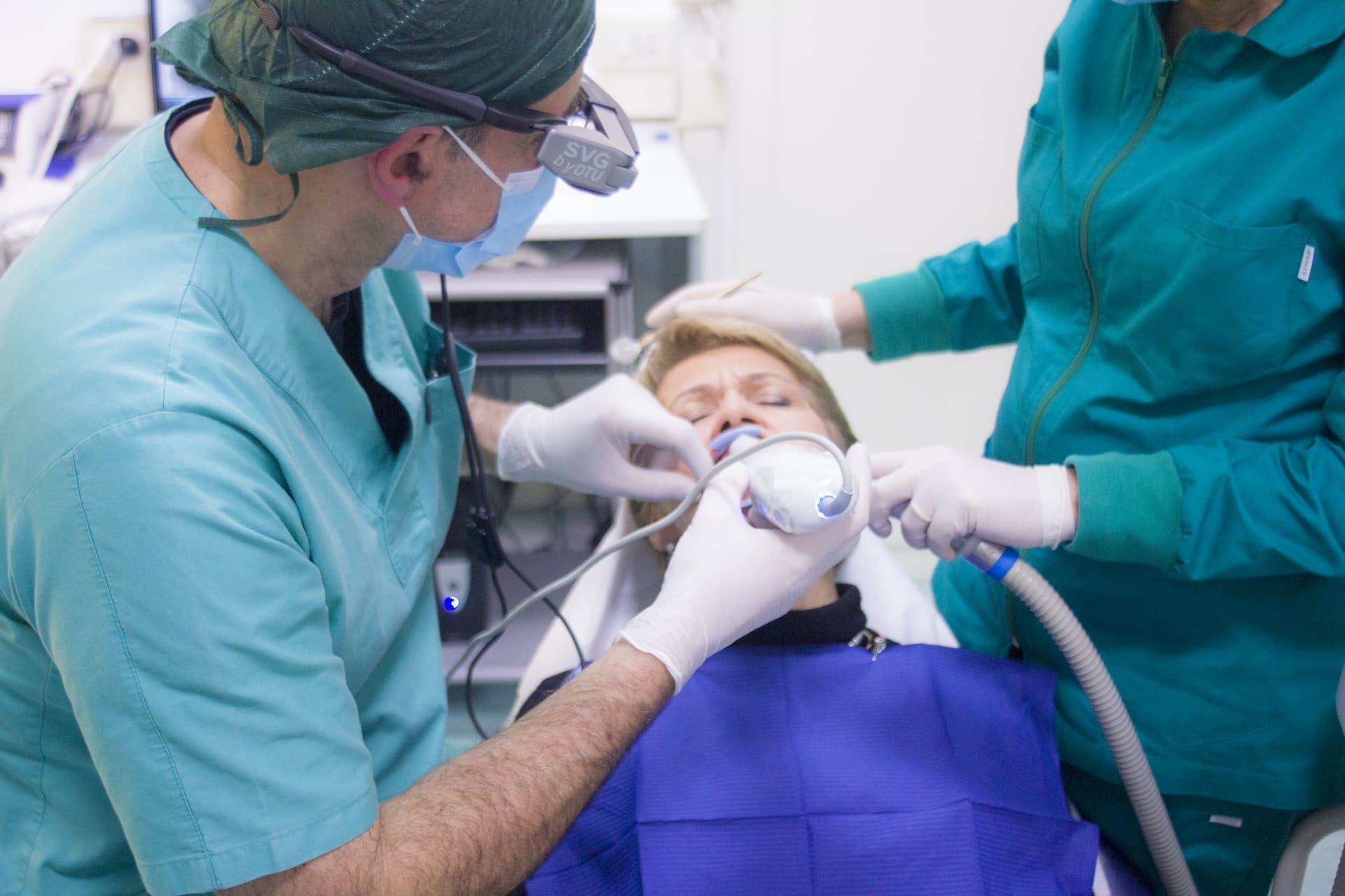 An adult undergoing orthodontic treatment, experiencing minimal discomfort due to innovative techniques.