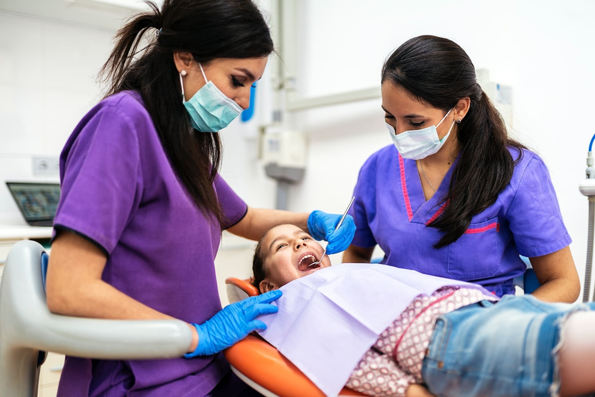 A child receiving a dental examination from a leading pediatric dentist in Newton, MA, ensuring a foundation for lifelong oral health.