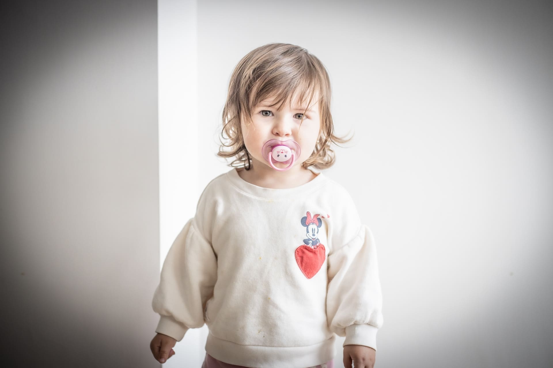 A child learning to give up thumb-sucking and pacifier use under the guidance of a top pediatric dentist in Newton, MA.