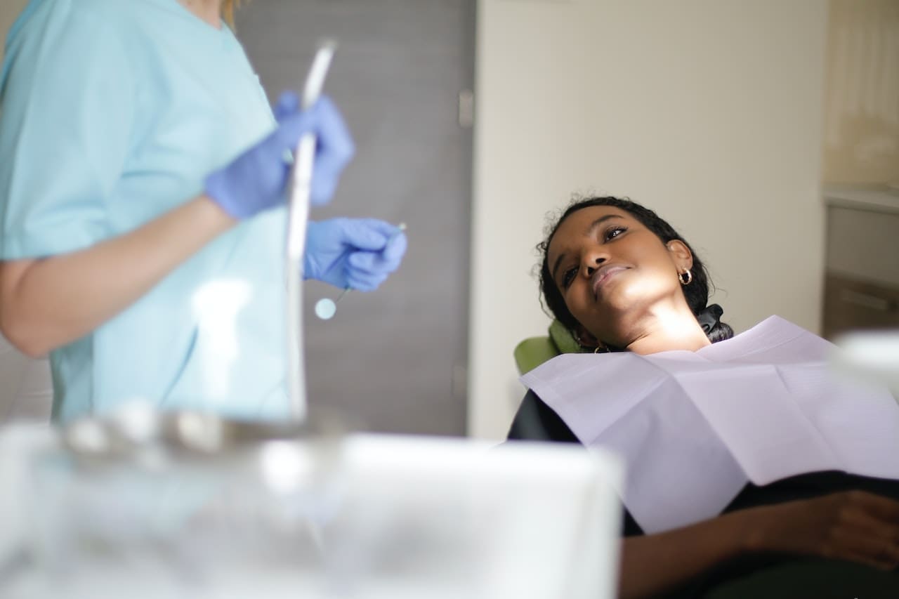 A patient receiving urgent dental care from a highly skilled dentist in Newton, MA, for a dental emergency.