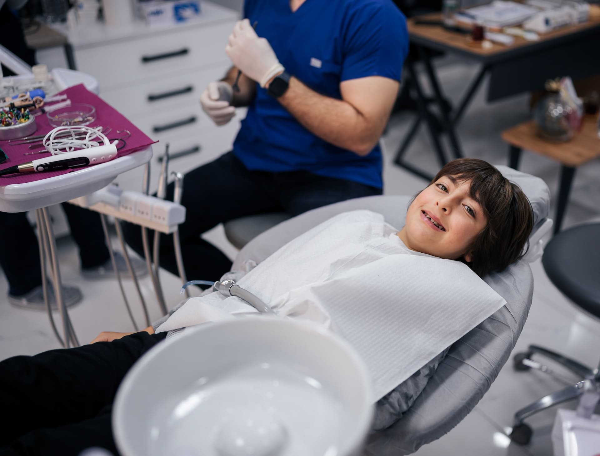 A child undergoing an interceptive orthodontic evaluation by a leading orthodontist in Newton, MA, for early dental intervention.