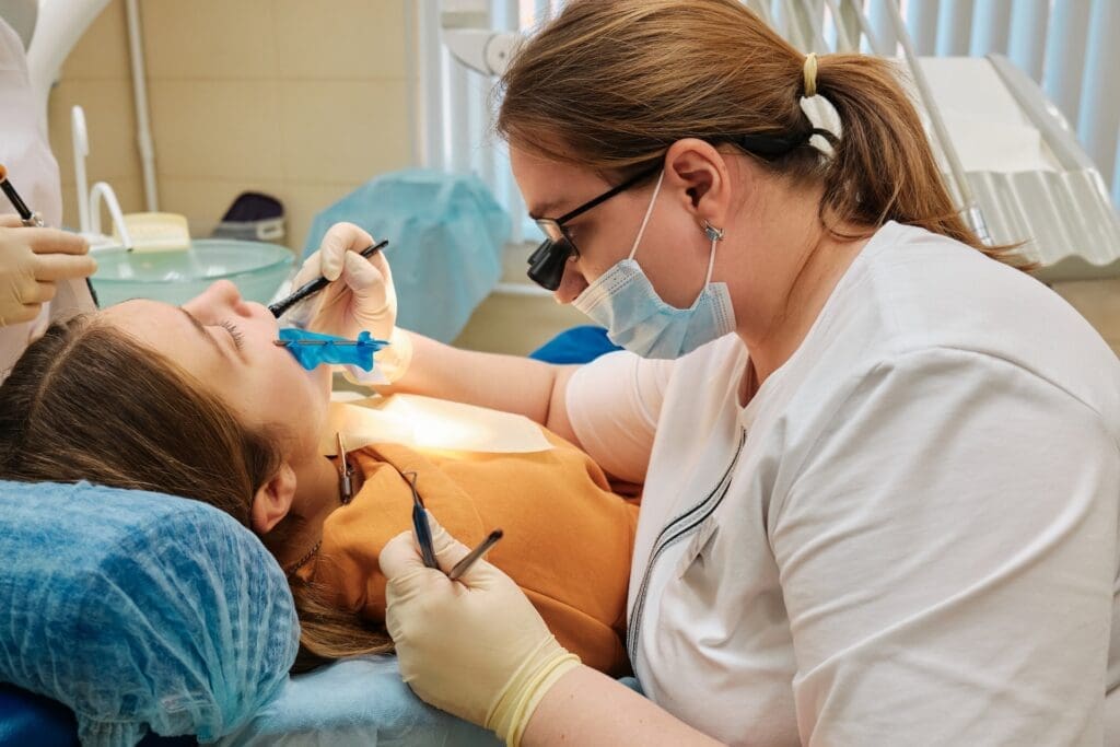 A child smiling confidently, showcasing healthy teeth and gums.