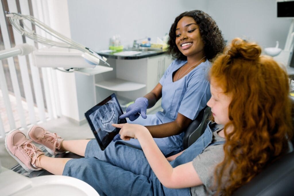 Image of a satisfied patient at Waban Dental Group, Newton, MA, enjoying the comfort of well-fitted dental implants.