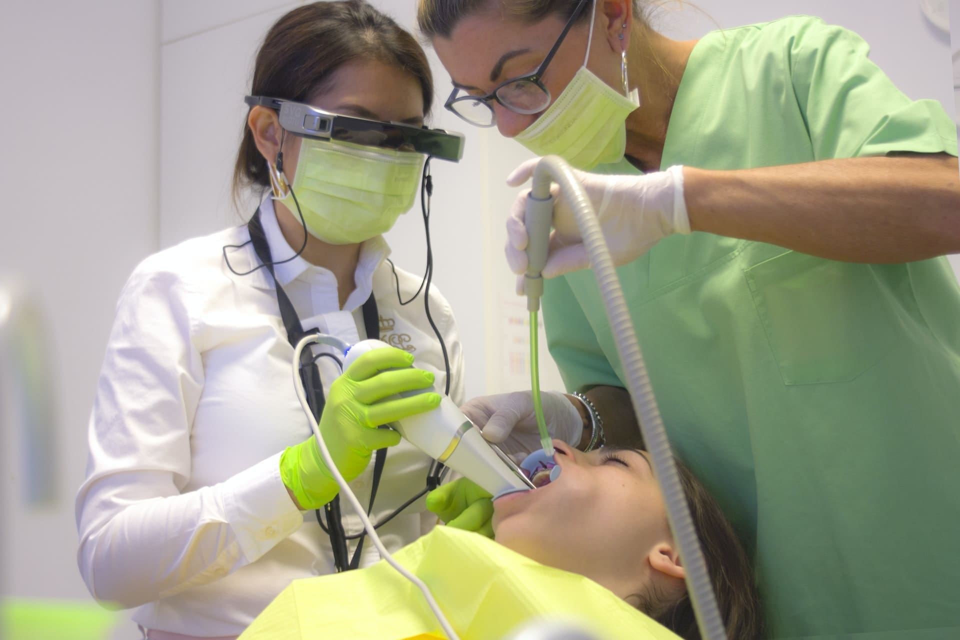 A dentist in Newton, MA, applying silver diamine fluoride on a patient's tooth to prevent cavities.
