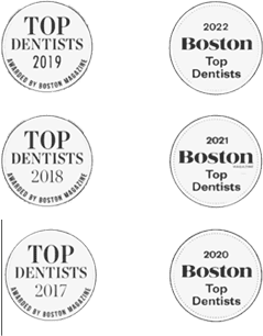 Award plaque from Boston Magazine, titled 'Best Dentist of Boston and Newton' and 'Best Dental Service Provider,' showcasing a golden trophy on a wooden base with the magazine's logo and the year.