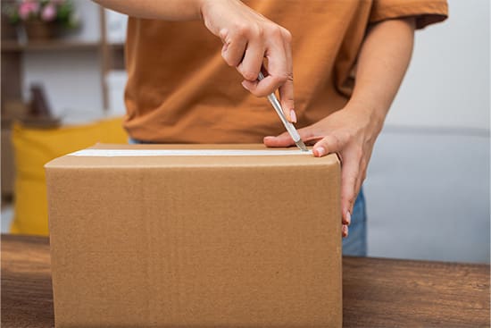A person opening a package