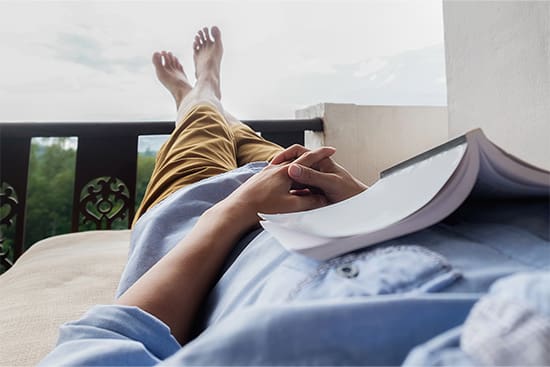 Patient relaxing after getting dental implants in Newton