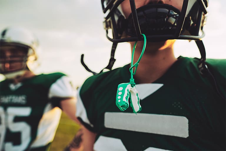Football player wearing a mouthguard.