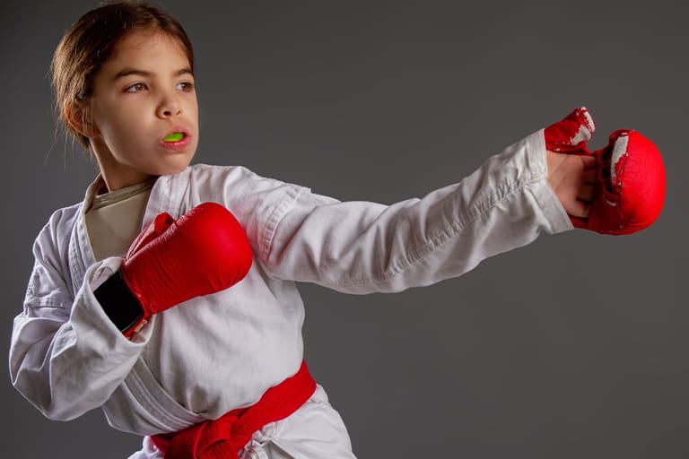 Girl wearing a mouthguard.