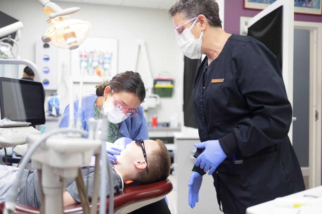 Dentists in Newton attending patient.