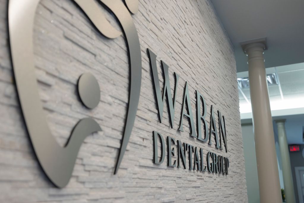 Waban Dental Group logo on practice wall.