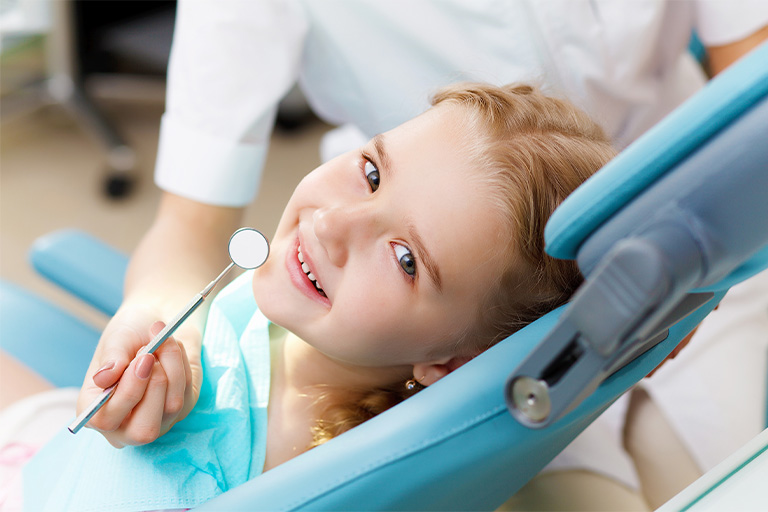 Little girl smiling before Phase 1 Orthodontics in Newton.