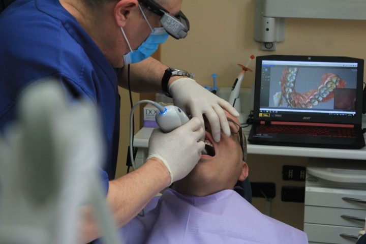 Maximizing Oral Hygiene: Effective Teeth Cleaning Techniques and Tips A person demonstrating effective teeth cleaning techniques for optimal oral hygiene.